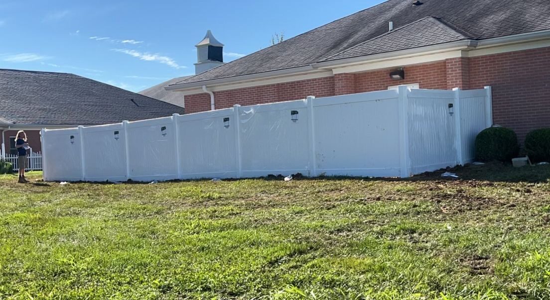 White vinyl privacy fence at farmhouse — S&S Fencing Kentucky