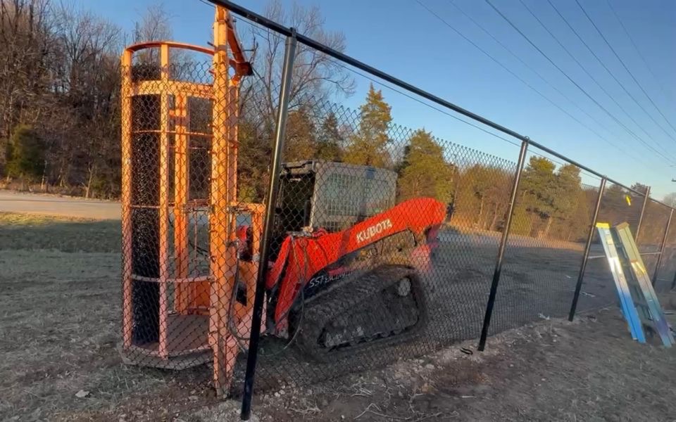 S&S Fencing Kubota tracked skid steer with hydraulic post driver attachment — Kentucky