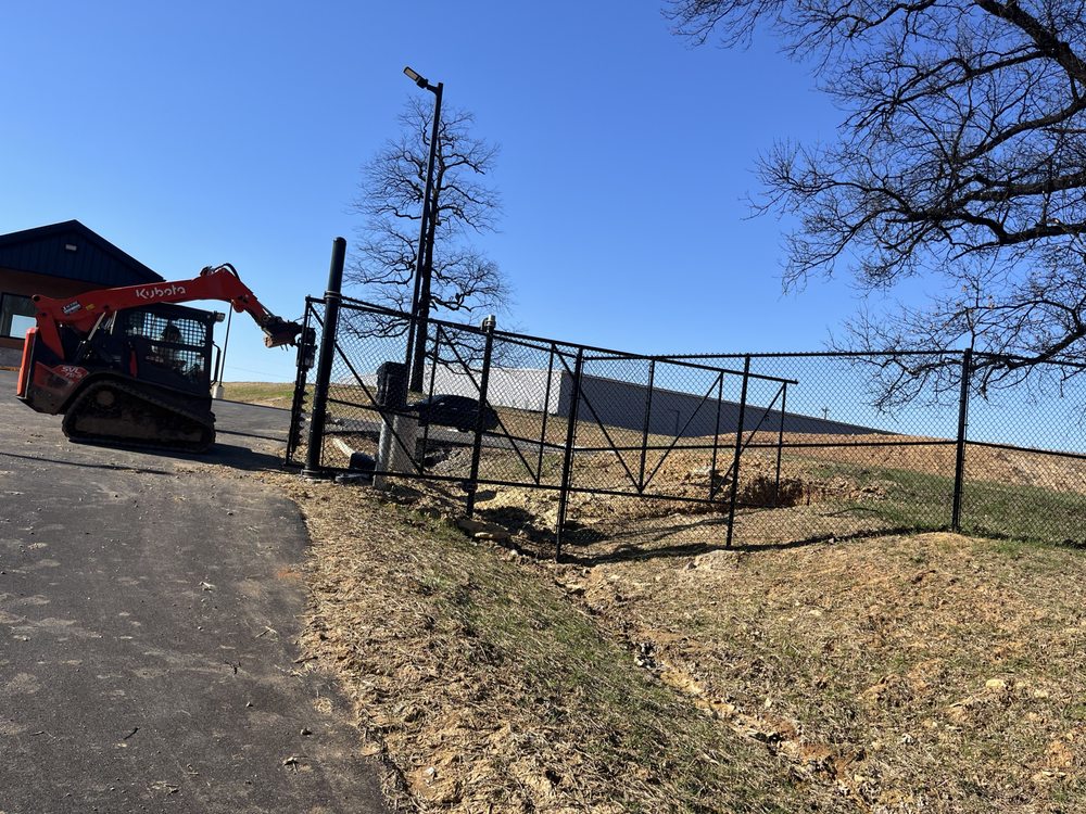 S&S Fencing skid steer installing fence posts — owned equipment, Kentucky