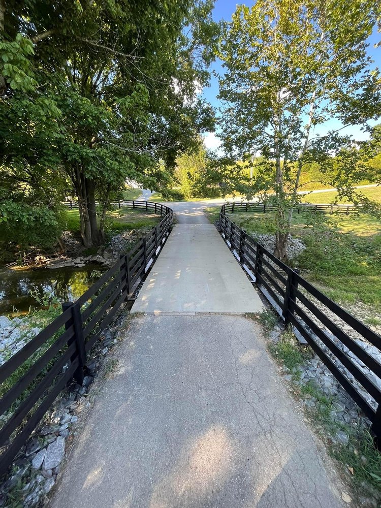 Custom wood plank bridge with rail built by S&S Fencing & Property Maintenance